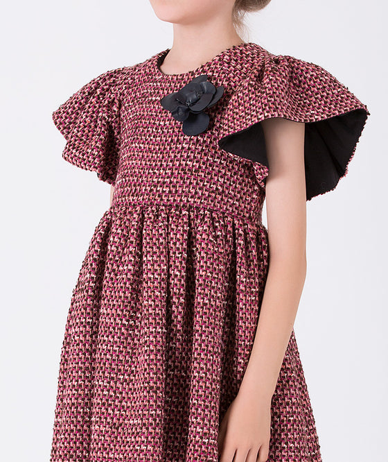 pink cozy tweed dress with short sleeves and a little black rose on the shoulder