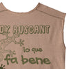 Beige sleeveless t-shirt with buttons, green graphics, and a lizard print on the back
