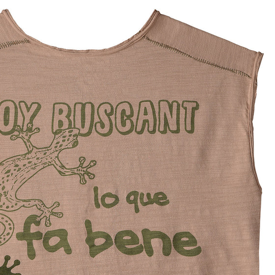 Beige sleeveless t-shirt with buttons, green graphics, and a lizard print on the back