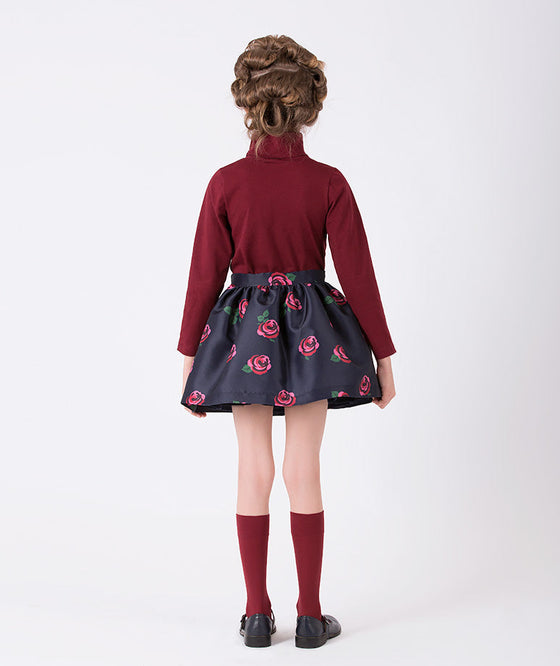 burgundy turtleneck blouse and navy skirt with rose prints