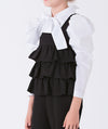 black layered jumper with elegant ecru blouse with a bow on the neckline