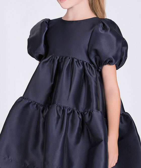 navy dress with flowy silhouette and whimsical balloon sleeves