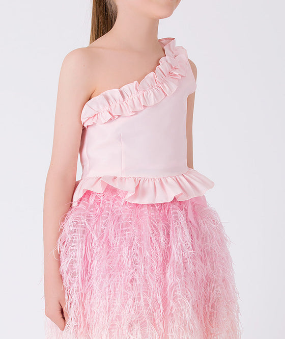 a set of a one shoulder ruffled pink blouse and matching pink skirt with feathers. perfect party outfit for spring and summer events