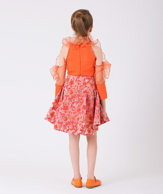 orange outfit with ruffles and flower embroidery 