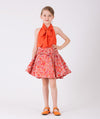 Cute orange blouse and a flared skirt with colorful jacquard prints and a bow on the waist