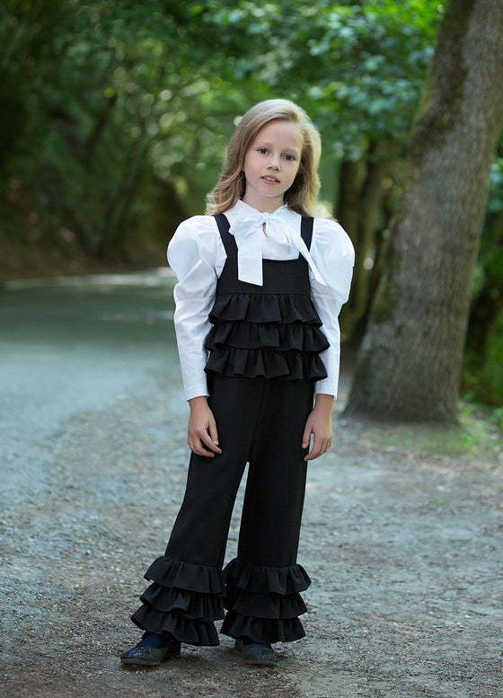 The perfect set of layered black jumper and bow detailed blouse with elegant sleeves